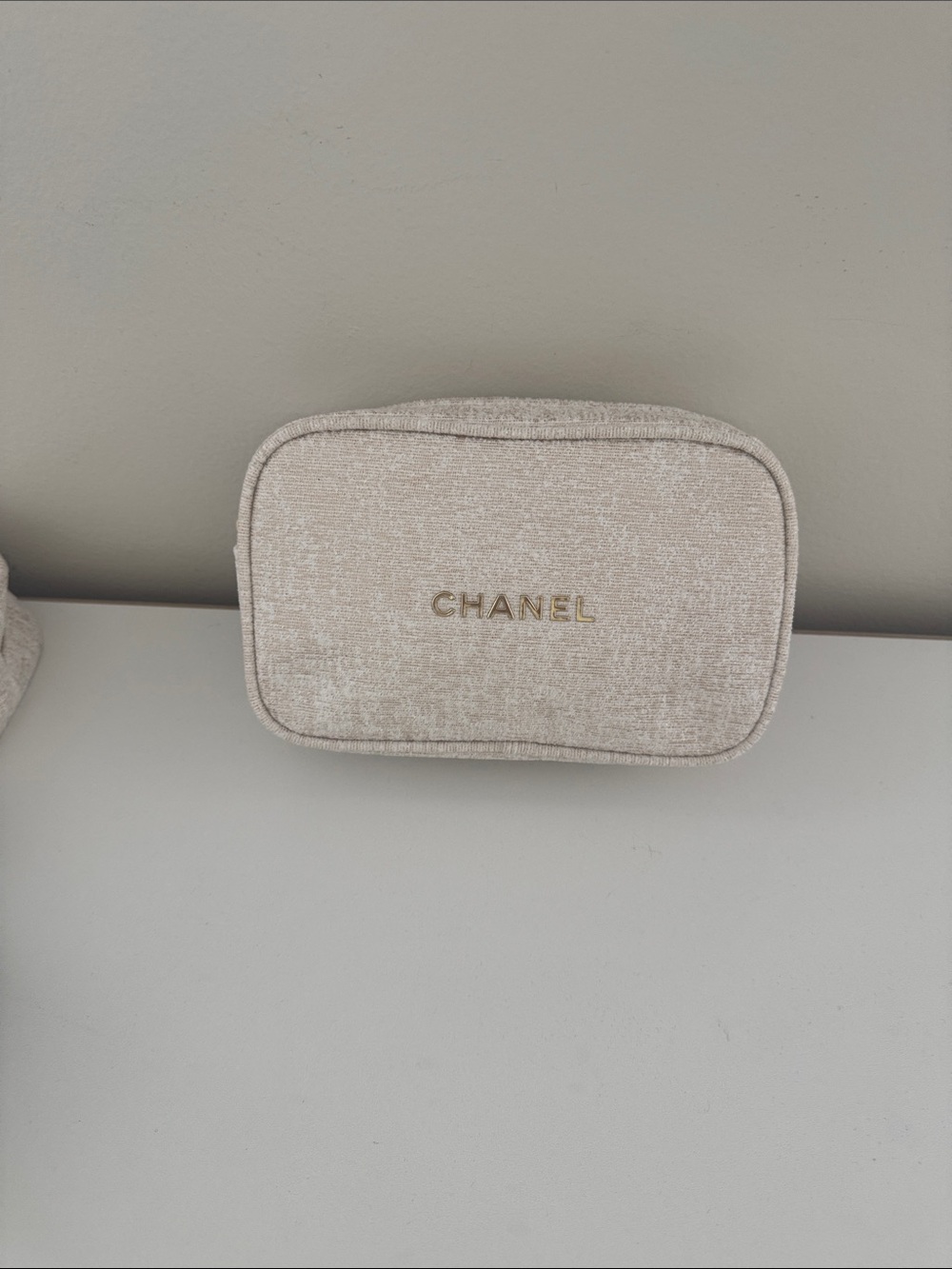 CHANEL Cream Textured Cosmetic Pouch with Gold Logo